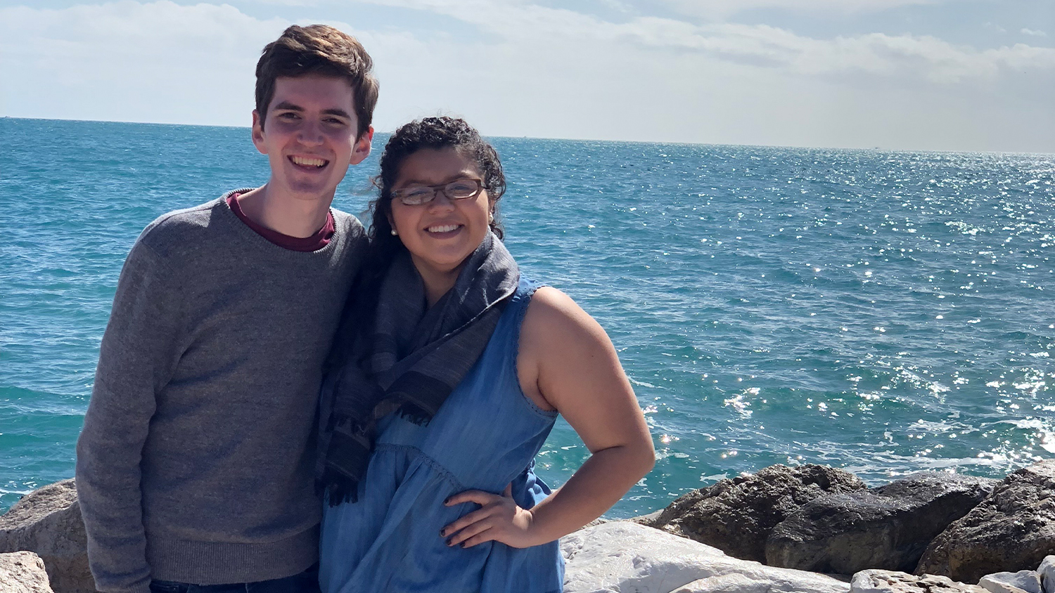 Mitchell Moravec and Jackie Gonzalez standing by ocean