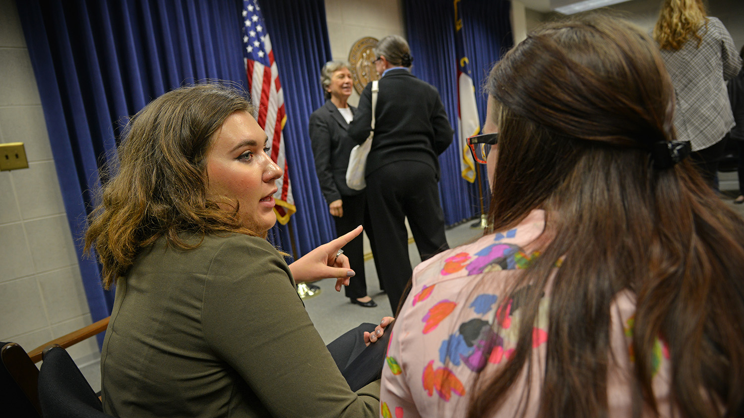 students talking in legislative building