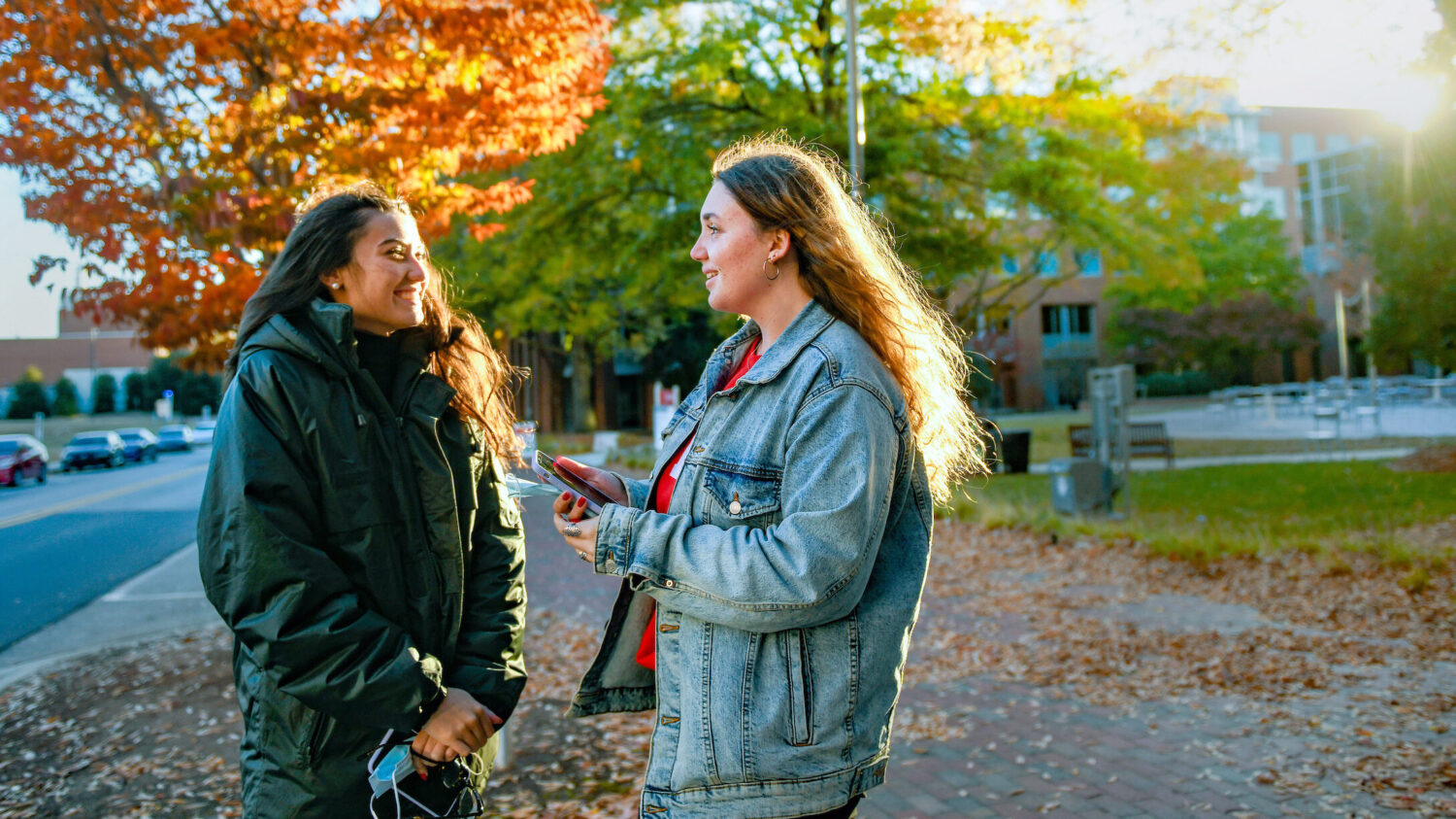 students talking on a fall day