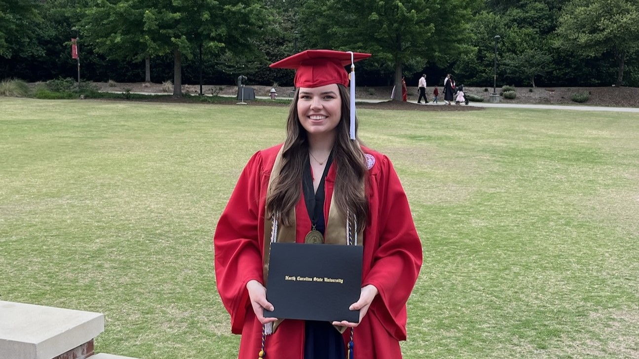 Heather Lee holding her diploma