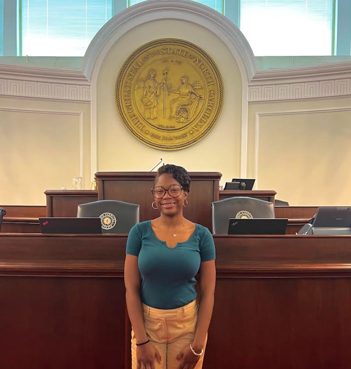 Nichole Hughes stands in city hall