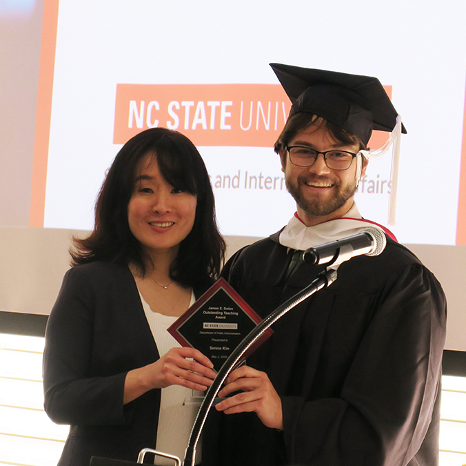 Serena Kim and student with award