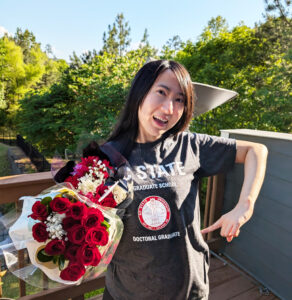 Yinman Zhong celebrates her Ph.D. with roses